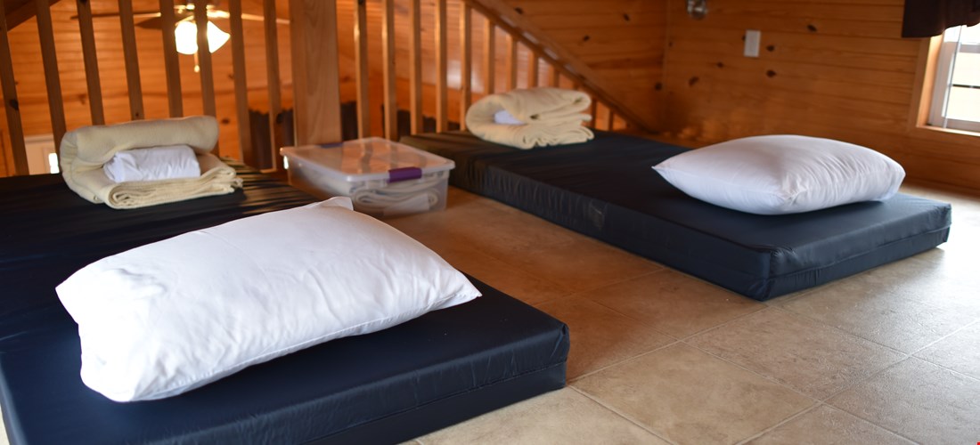 Children's mattresses in the loft of the bunk beds with loft deluxe cabin