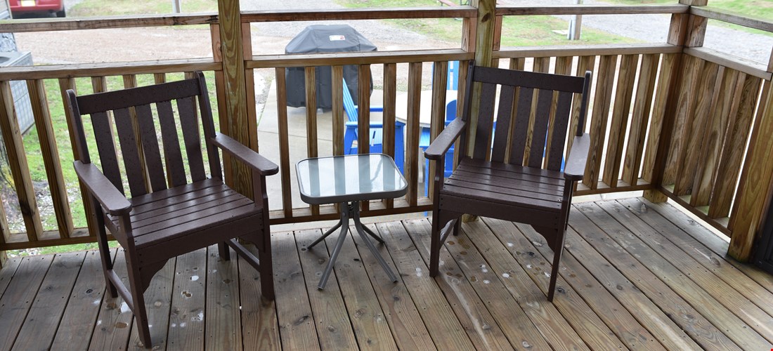 Outside seating on the deck of a studio deluxe cabin