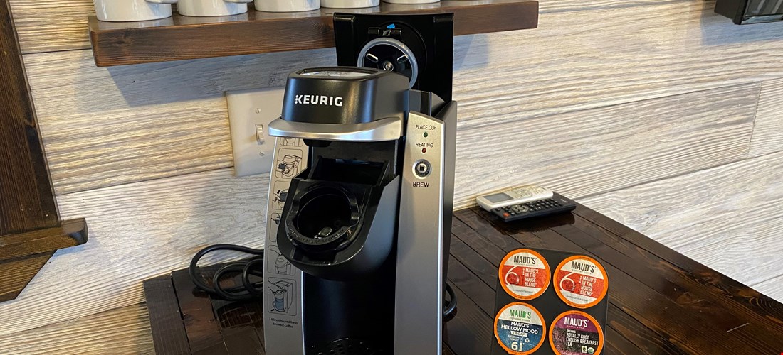 Keurig coffee maker and coffee in a deluxe cabin